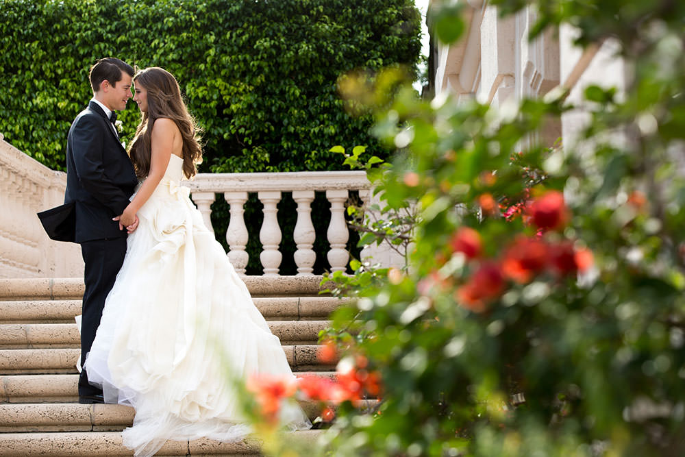 Bride and groom kissing on the backlawn at the Biltmore Hotel
