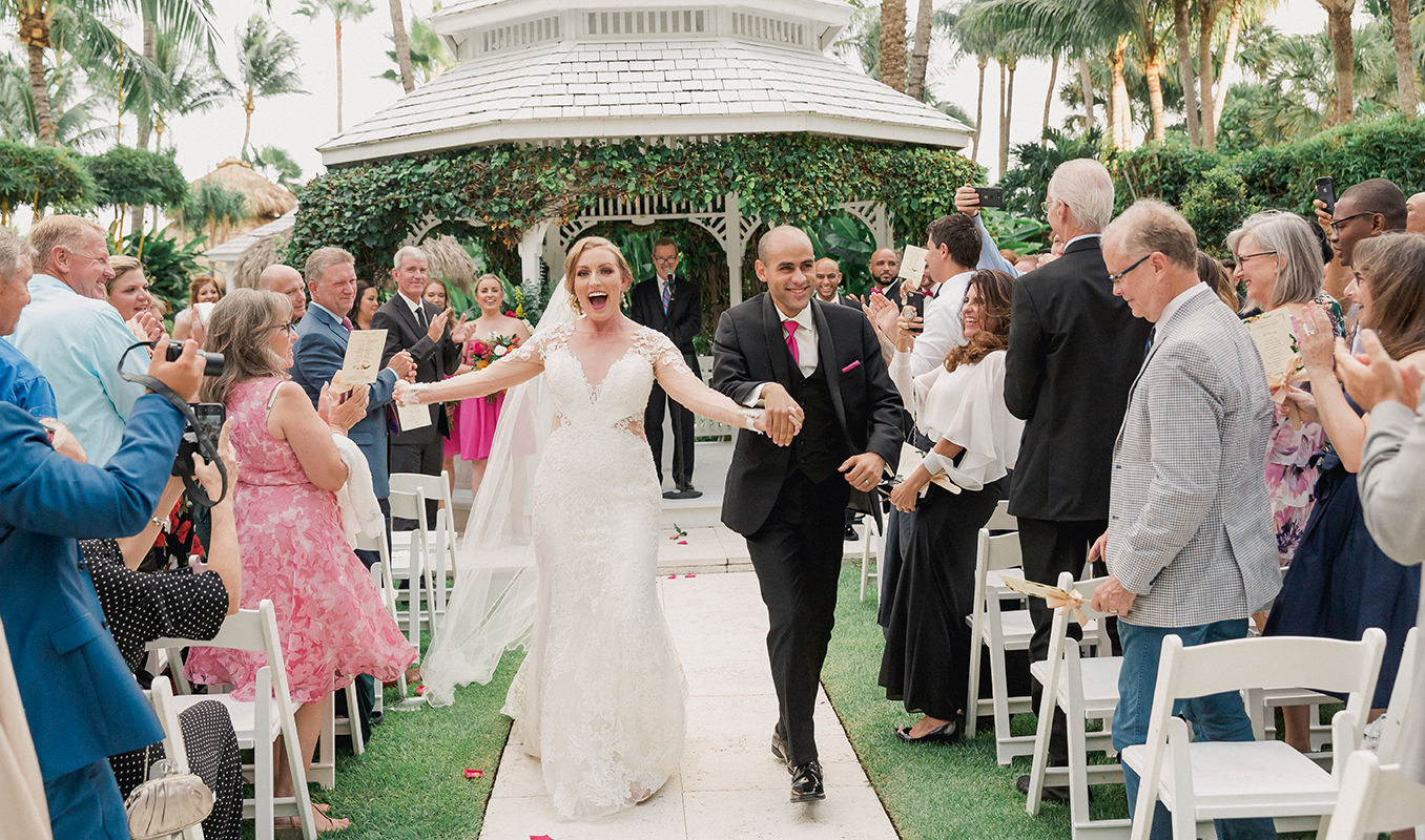 Bride and groom leaving wedding ceremony at the Palms Hotel