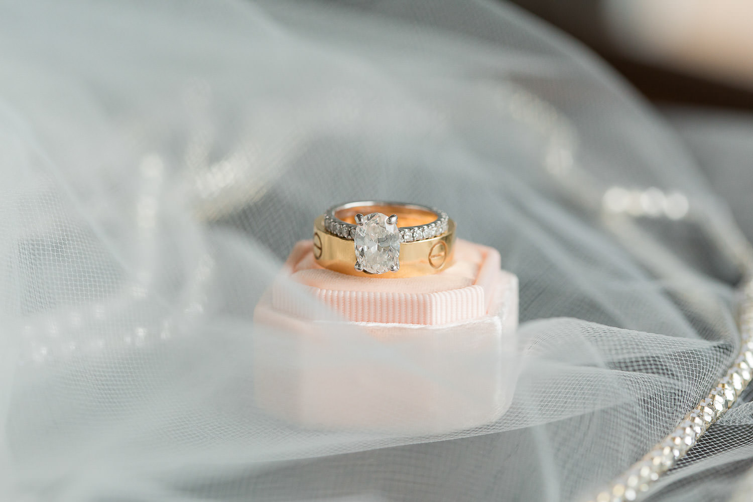 A diamond wedding ring on a custom Mrs. Box.